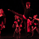 Brewery Arts School Dance Platform dancerse in red light.