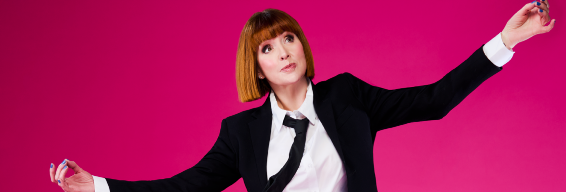 Cally Beaton in a black and white suit holding a yoga pose against a bright pink background
