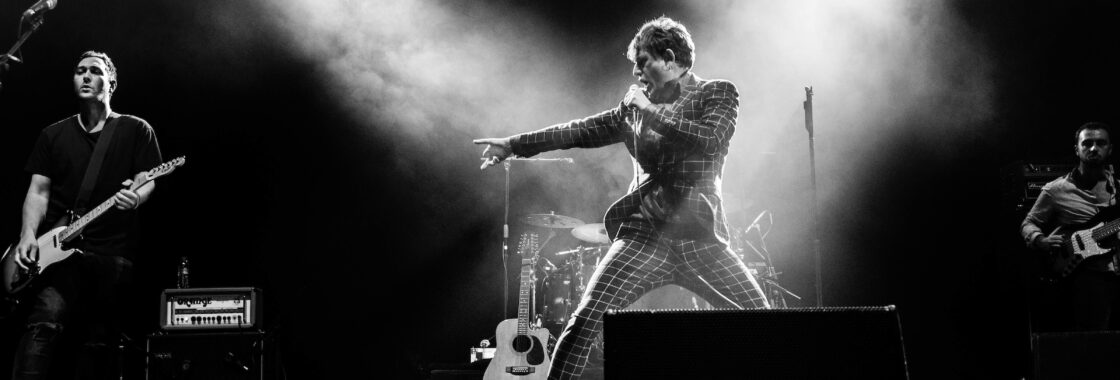 My Life Story performing on stage in black and white
