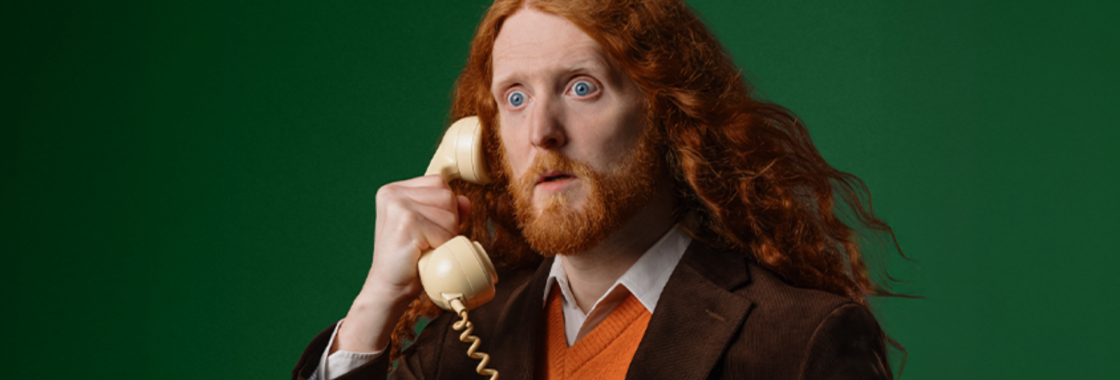 Comedian on the phone with a green background