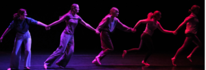 Snapshots of dancers on stage with dramatic lighting and shapes