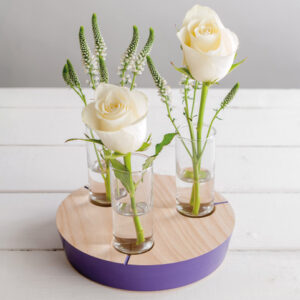 Handmade wooden table centre piece with glass vases and flowers